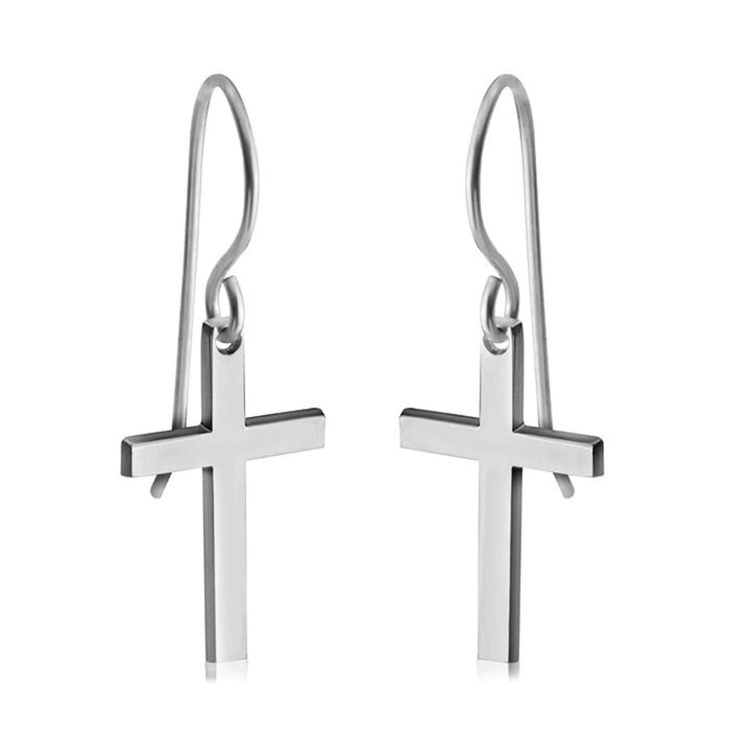Pair of silver cross earrings on a white background