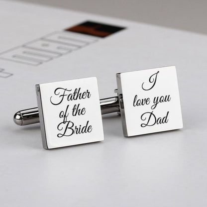 Cufflinks with 'Father of the Bride' and 'I love you Dad' text on a newspaper background