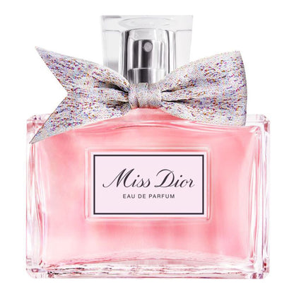 Miss Dior Eau de Parfum bottle with a decorative bow on a white background