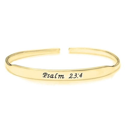 Gold bracelet with 'Psalm 23:4' engraving on a white background