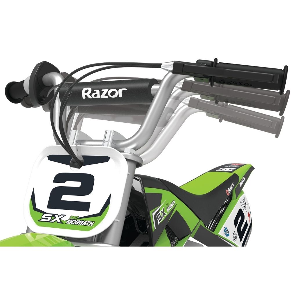 Close-up of a green and black toy dirt bike with 'Razor' branding on the handlebars.