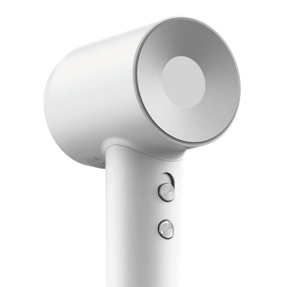 White hair dryer with a focus on the nozzle and control panel on a white background
