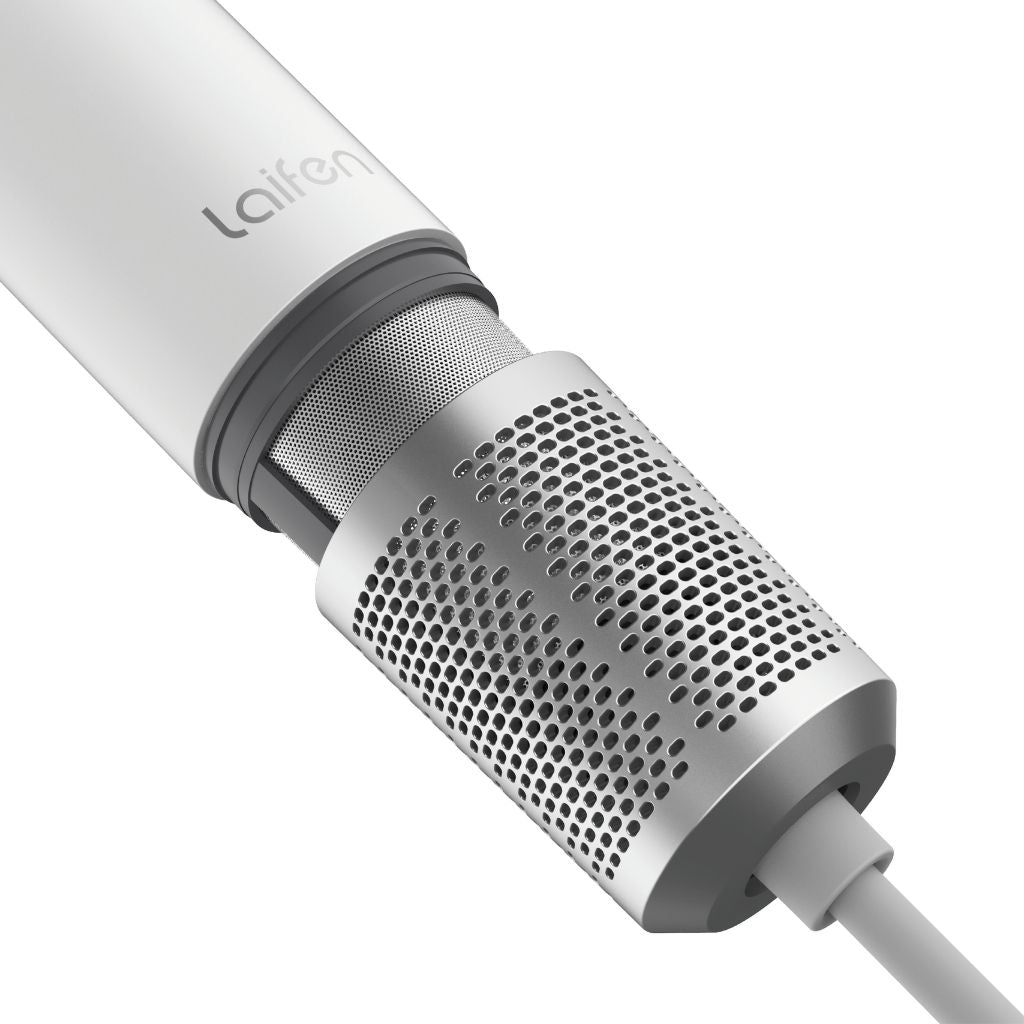 Close-up of a white microphone with a perforated design on a white background