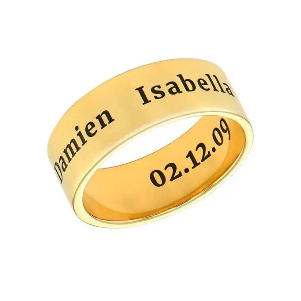 Gold ring with engraved names and date on a white background