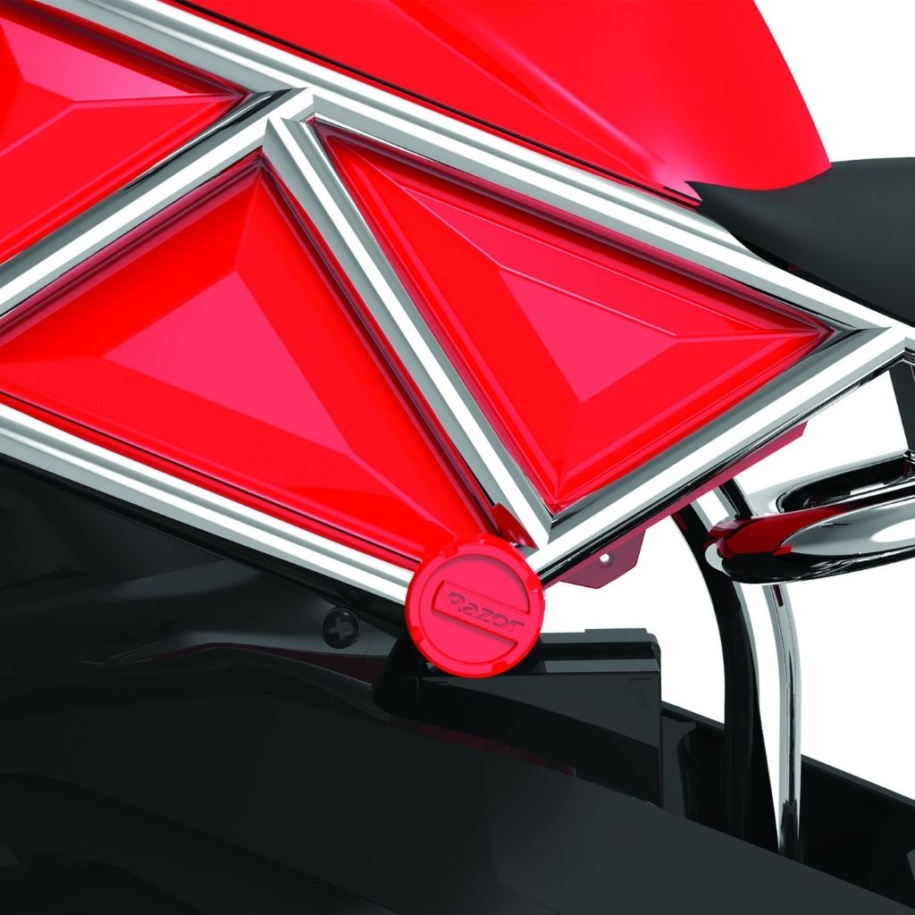Close-up of a red and black motorcycle with a prominent brand logo on a white background