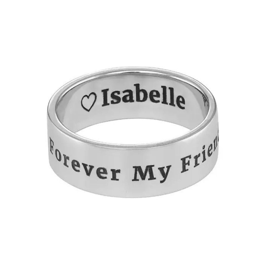 Silver ring with engraved text on a white background