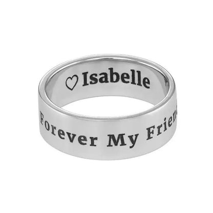 Silver ring with engraved text on a white background