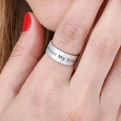Silver ring with 'Forever My Friend' engraving on a finger