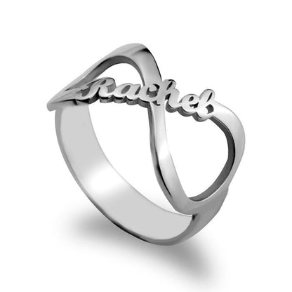 Silver ring with 'Racheal' engraved on a white background