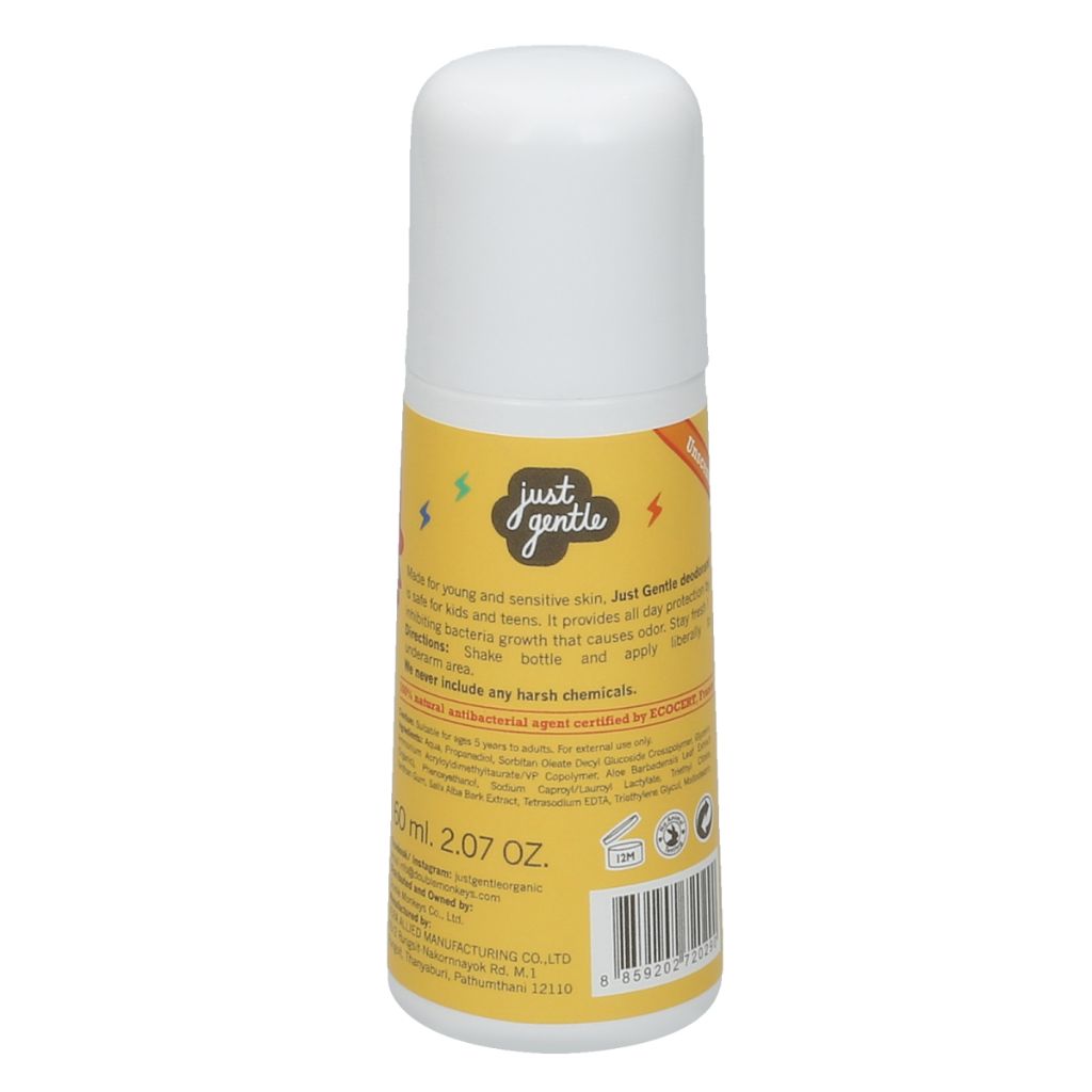 Deodorant bottle with yellow label and white cap on a white background