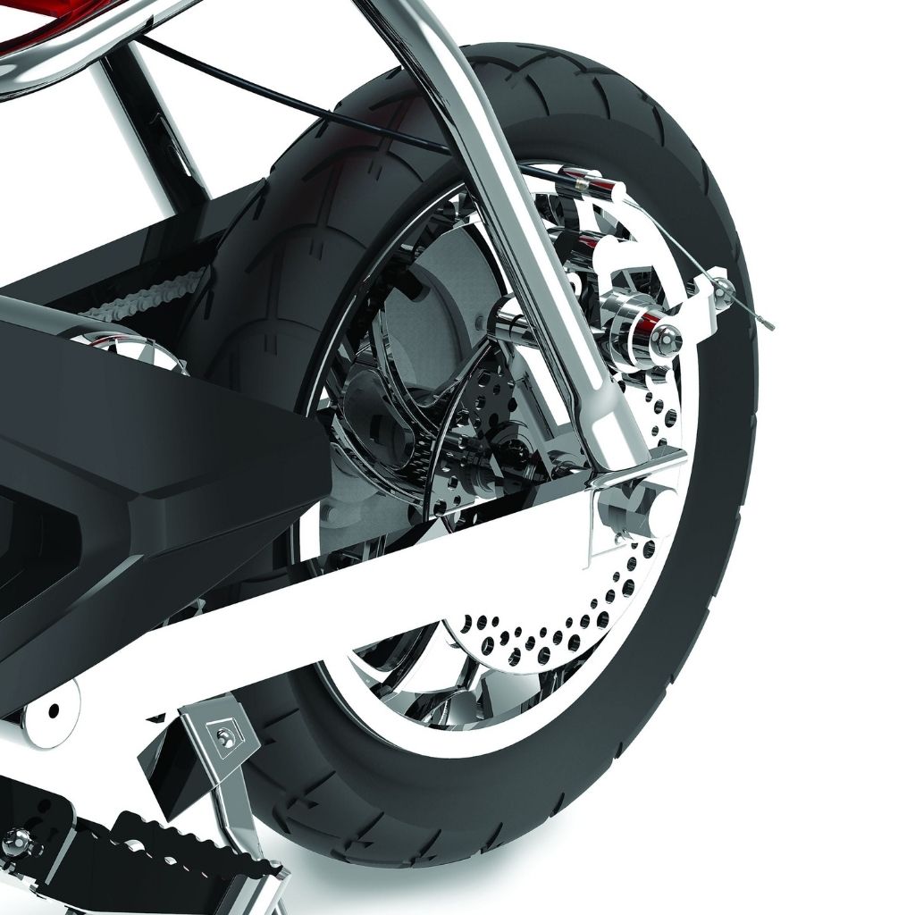 Close-up of a motorcycle wheel with a white background