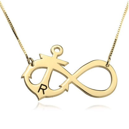 Gold necklace with an infinity symbol pendant on a white background