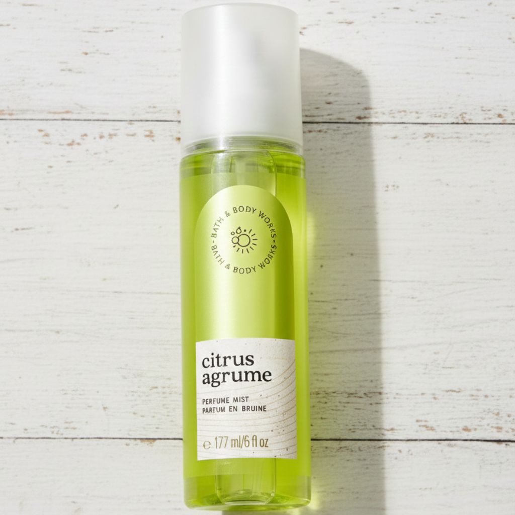 Bottle of 'Citrus Agrume' perfume mist on a light wooden surface
