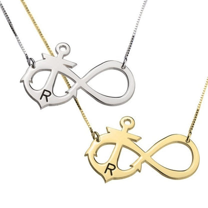 Two infinity symbol necklaces, one silver and one gold, on a white background.