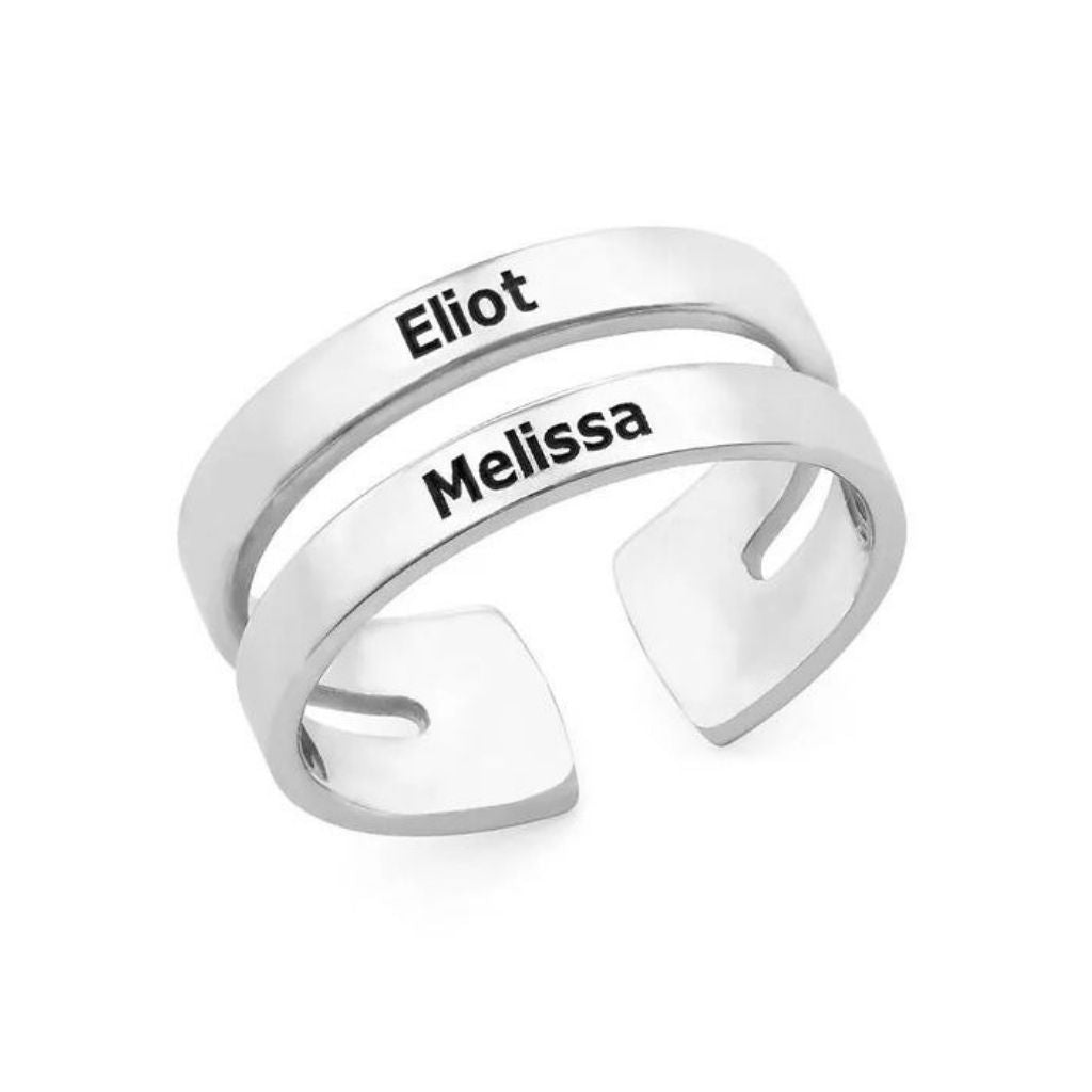 Silver ring with engraved names 'Eliot' and 'Melissa' on a white background
