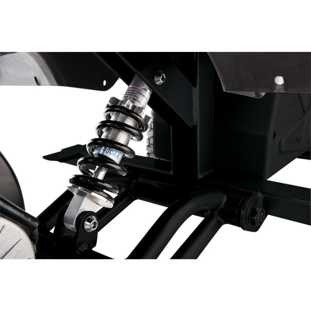 Close-up of a motorcycle suspension system with visible branding on a white background