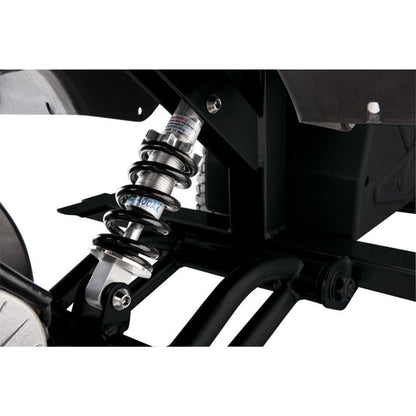 Close-up of a motorcycle suspension system with visible branding on a white background