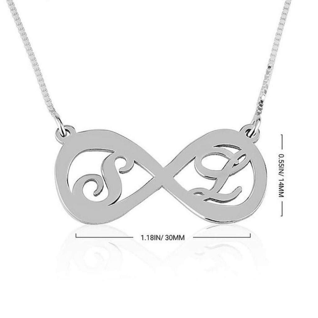 Silver infinity necklace with 'S' and 'L' initials on a white background