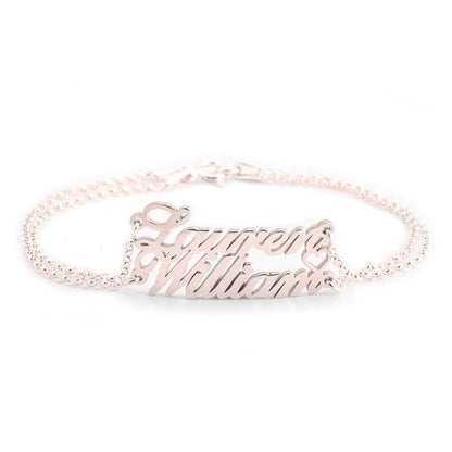 Rose gold bracelet with 'Laylene Williams' engraving on a white background