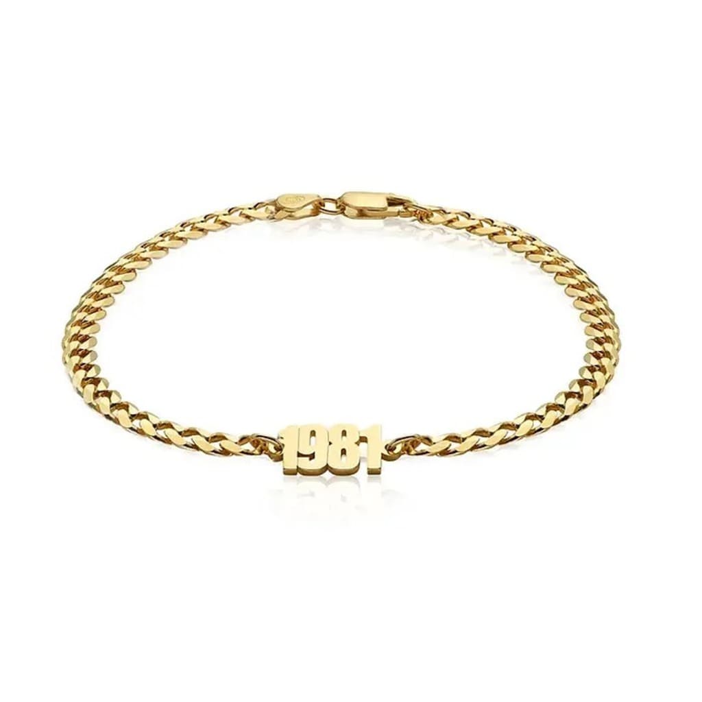 Gold bracelet with 'BBI' initials on a white background