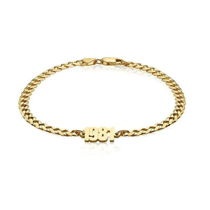 Gold bracelet with 'BBI' initials on a white background