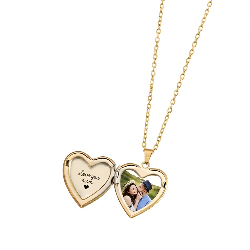 Heart-shaped gold locket with 'Love you mom' engraving and photo of a couple on a white background