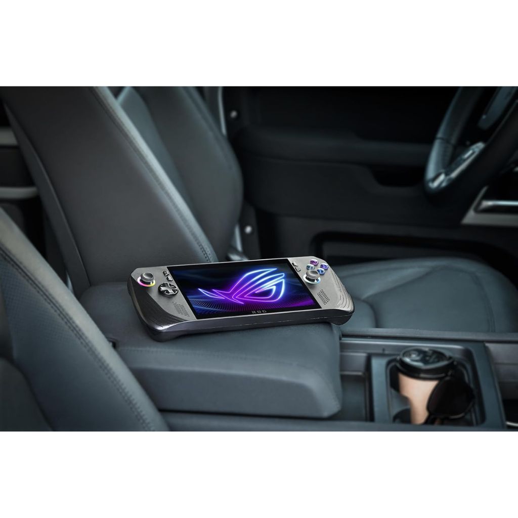 Gaming device on a car's cup holder with a visible brand logo.