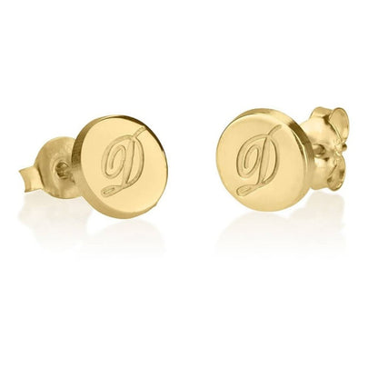 Gold earrings with 'D' initials on a white background
