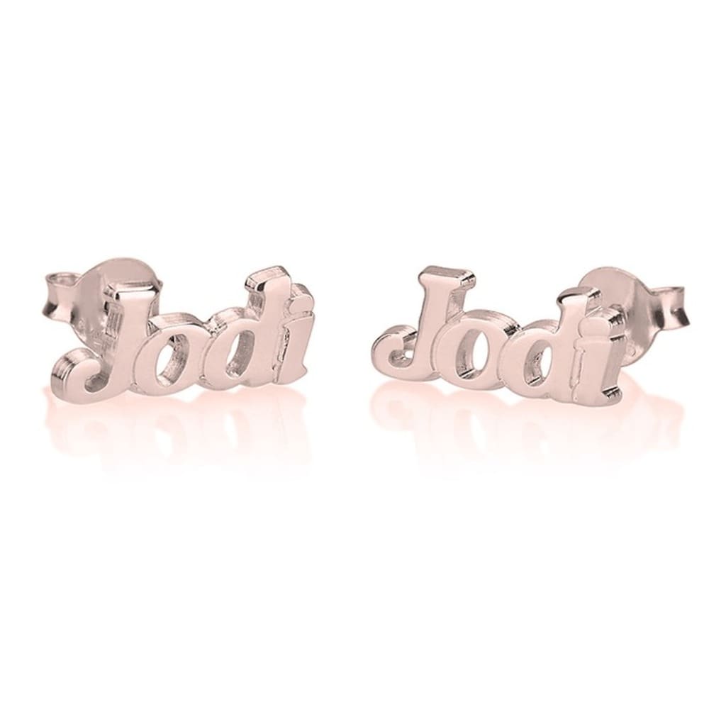 Pair of rose gold 'Jodi' name stud earrings on a white background