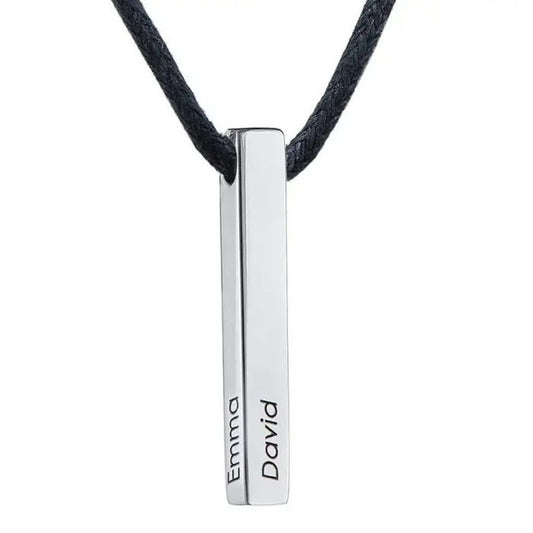 Silver necklace with engraved names on a white background