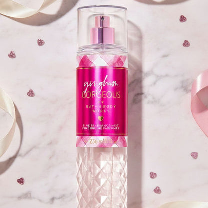 Bath & Body Works 'Gingham Gorgeous' fragrance mist bottle on a marble surface with decorative elements.