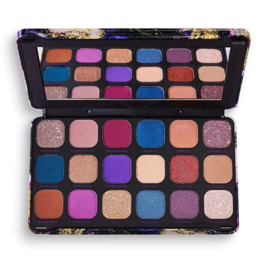 Makeup compact with a colorful marble design and 'Revolution' branding on a white background