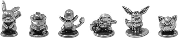 Set of small metallic figurines resembling a cat, dog, and other animals on a white background