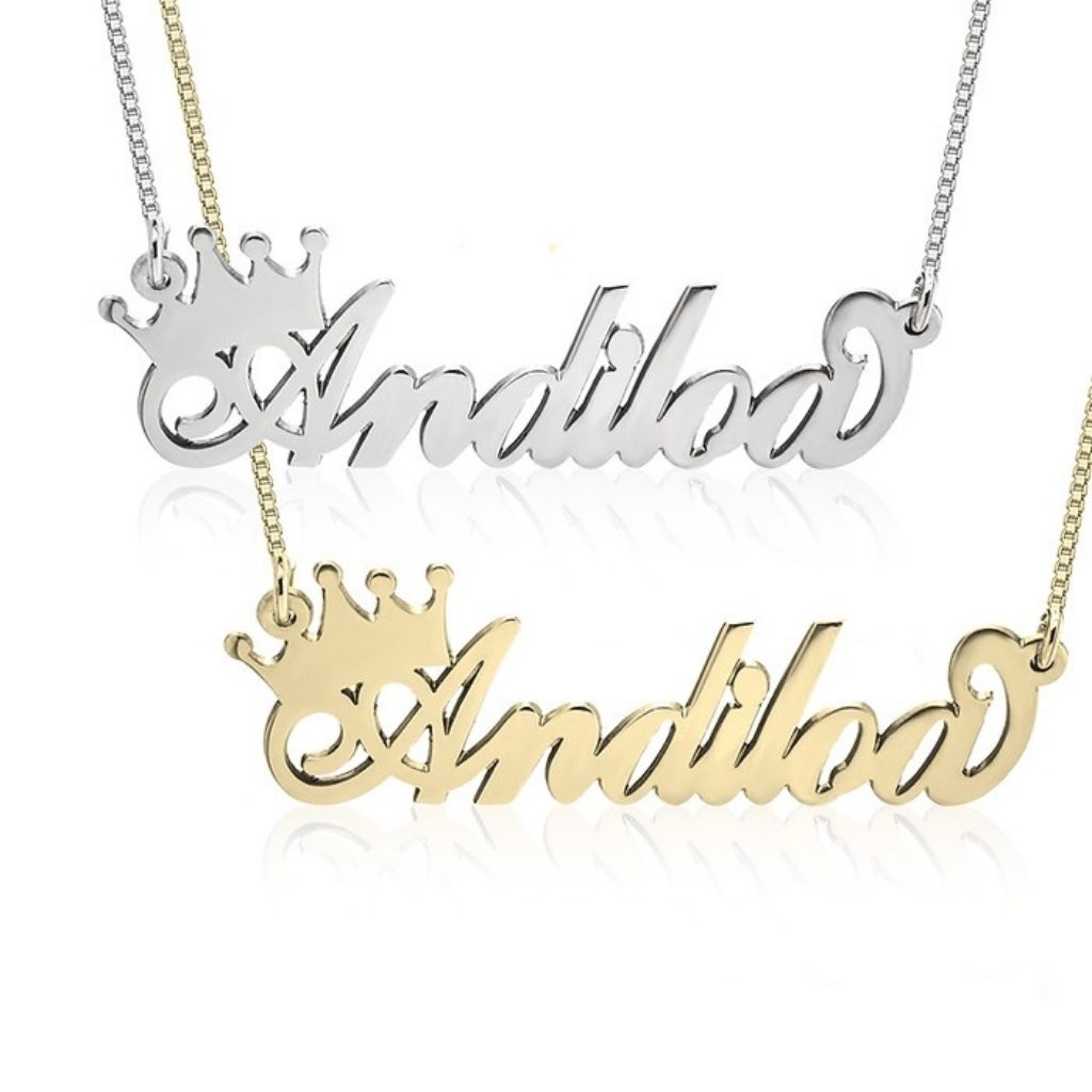 Silver and gold 'Andiloo' name necklaces with crowns on a white background