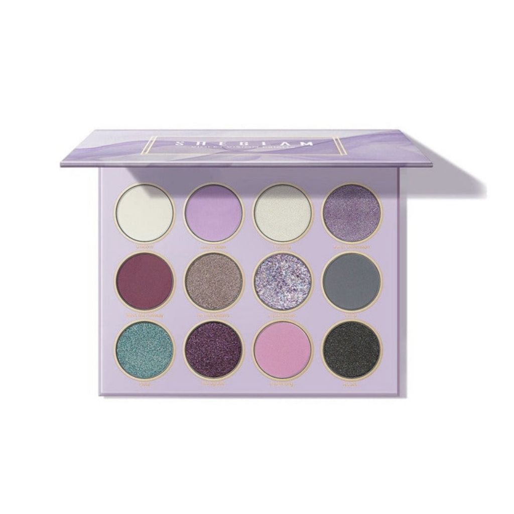Makeup palette with various colors on a white background