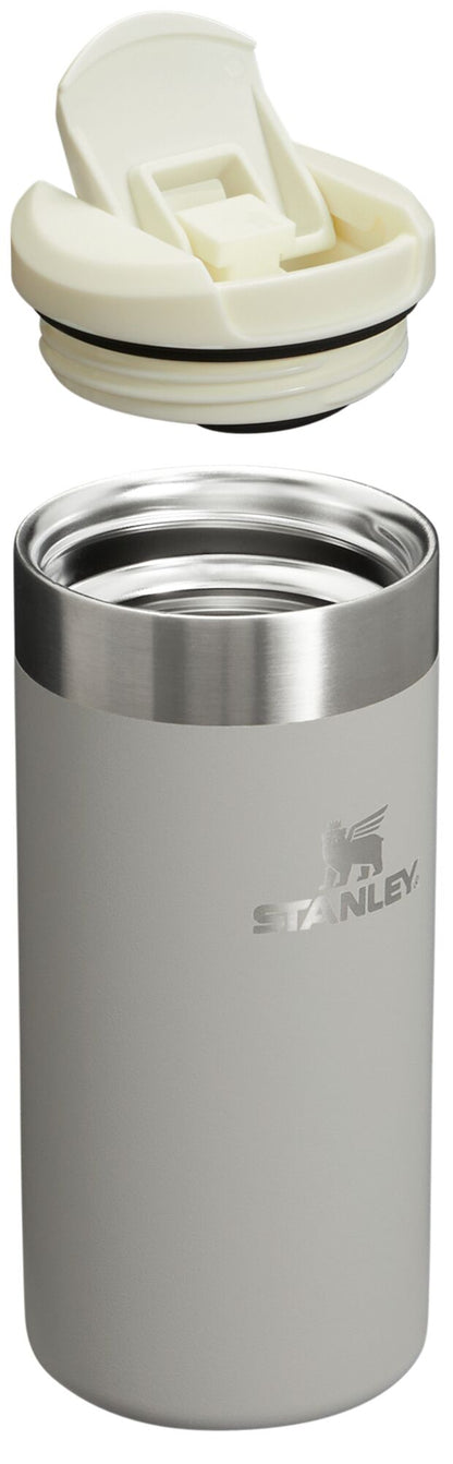 Stanley stainless steel tumbler with white lid on a white background