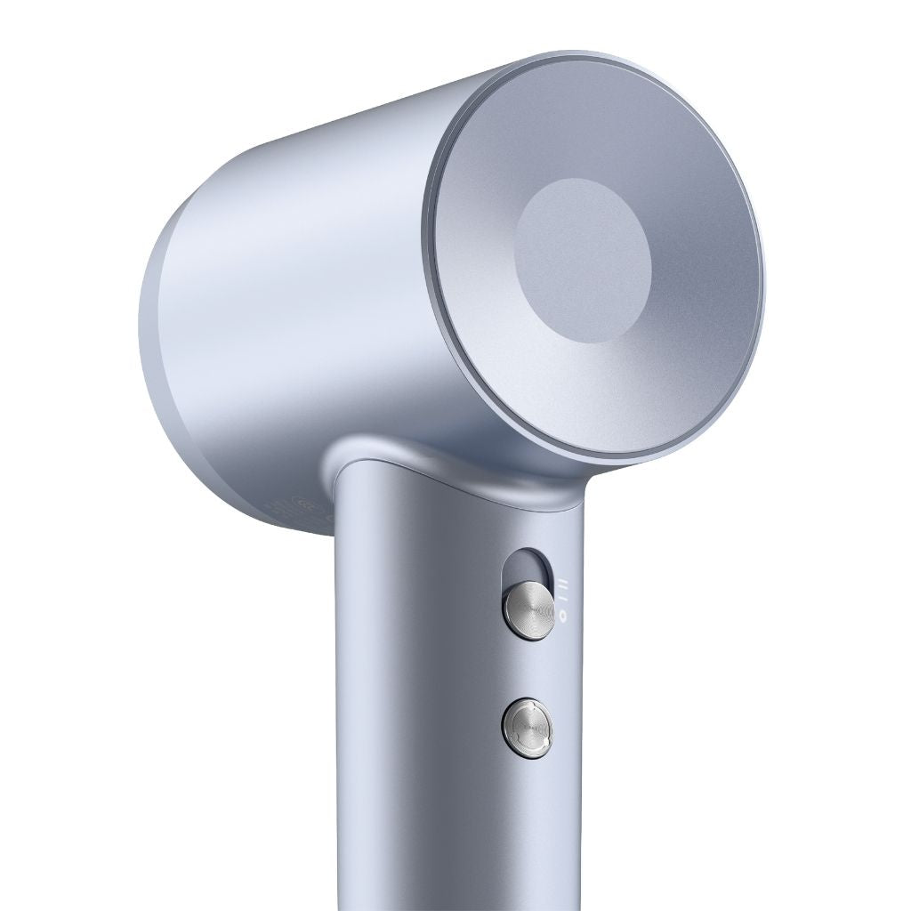 Close-up of a silver hair dryer on a white background