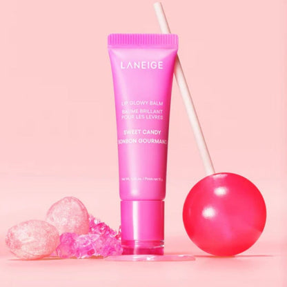 Pink Laneige lip balm with a lollipop on a pink background