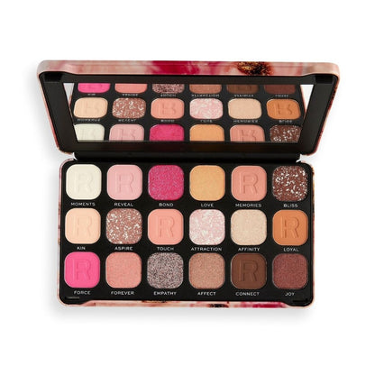 Makeup palette with various shades of eyeshadow on a white background