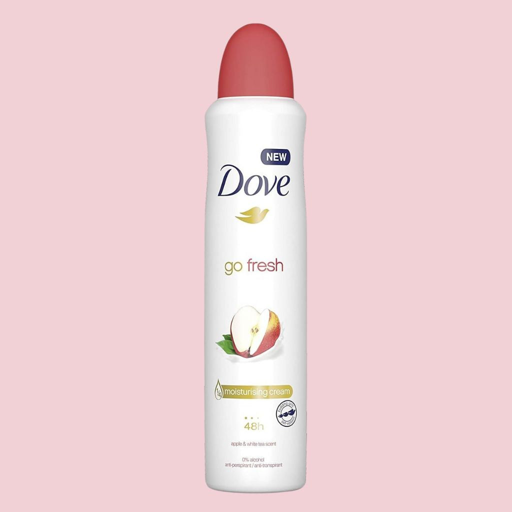 Dove go fresh deodorant spray on a pink background
