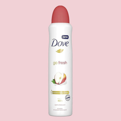 Dove go fresh deodorant spray on a pink background