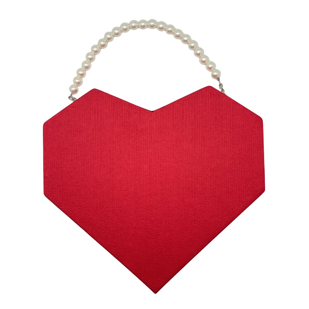 Red heart-shaped bag with a pearl handle on a white background
