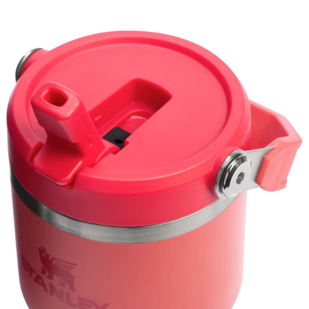 Red Stanley insulated mug with a lid on a white background
