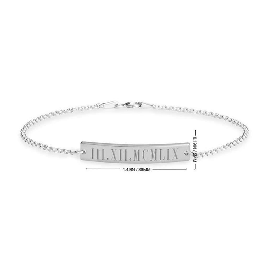 Silver bracelet with Roman numeral engraving on a white background