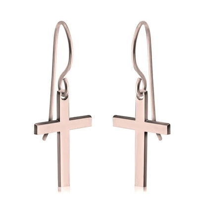 Rose gold cross earrings on a white background