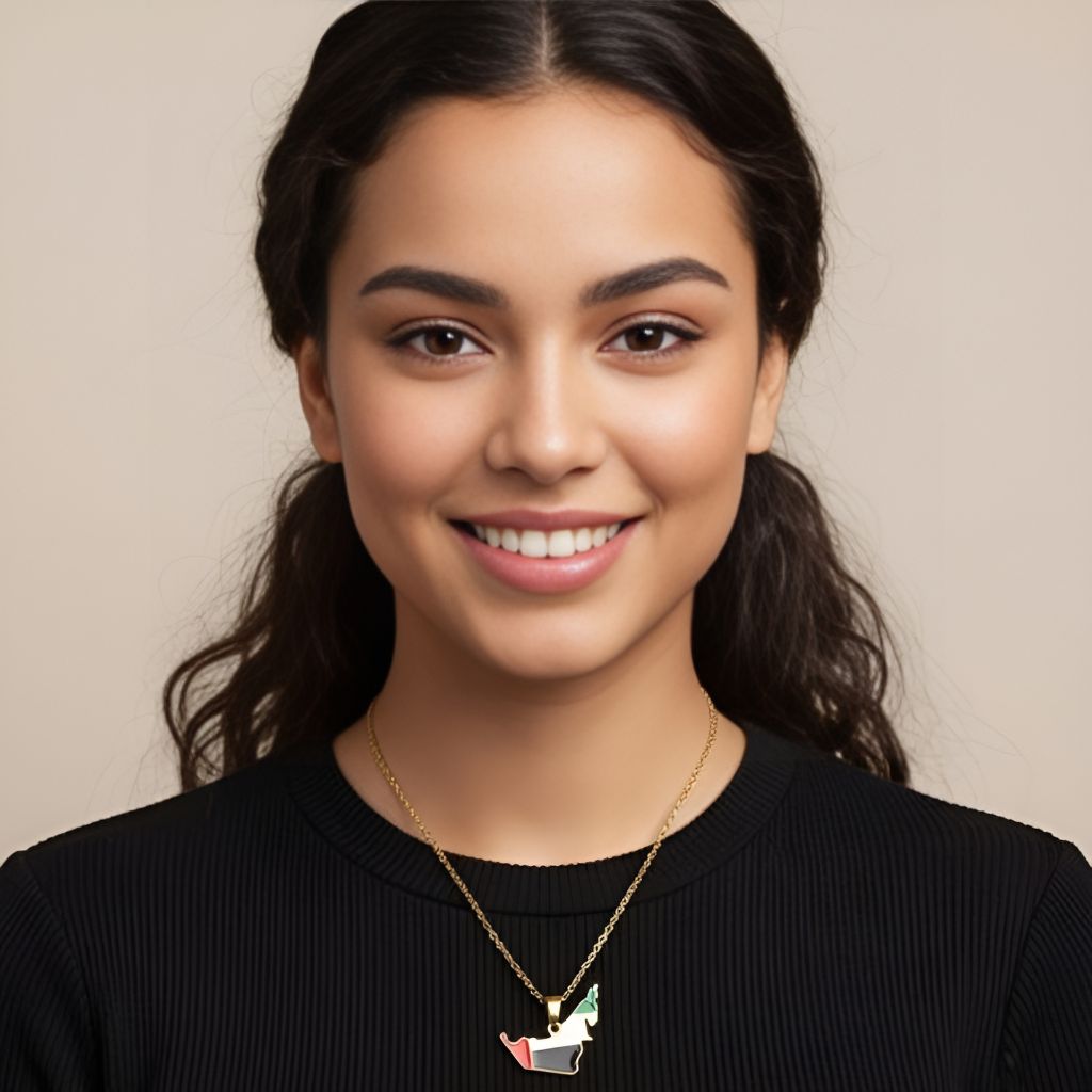 Woman wearing a black top and a necklace with a pendant against a beige background