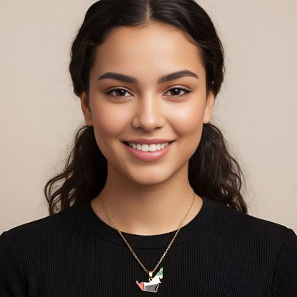 Woman wearing a black top and a necklace with a pendant against a beige background