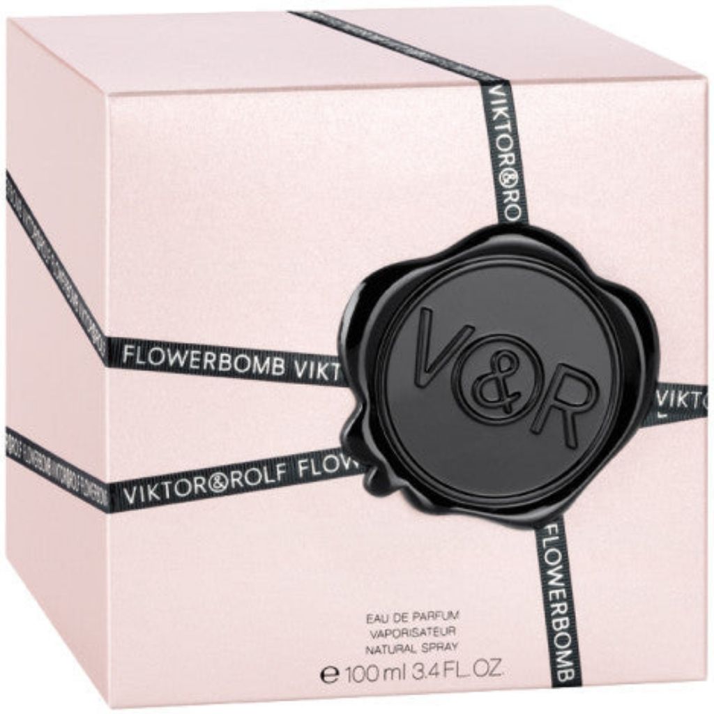 Viktor & Rolf Flowerbomb perfume packaging on a light pink background