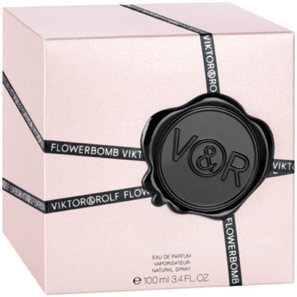 Viktor & Rolf Flowerbomb perfume packaging on a light pink background