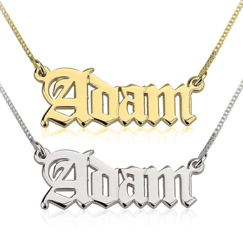 Gold and silver 'Adam' name pendants on white background